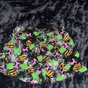 Chubbies Green and Pink Swim Trunks with Vibrant Design